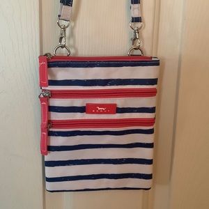 Scout crossbody 3 zippers, one back pouch, blue stripes like new condition